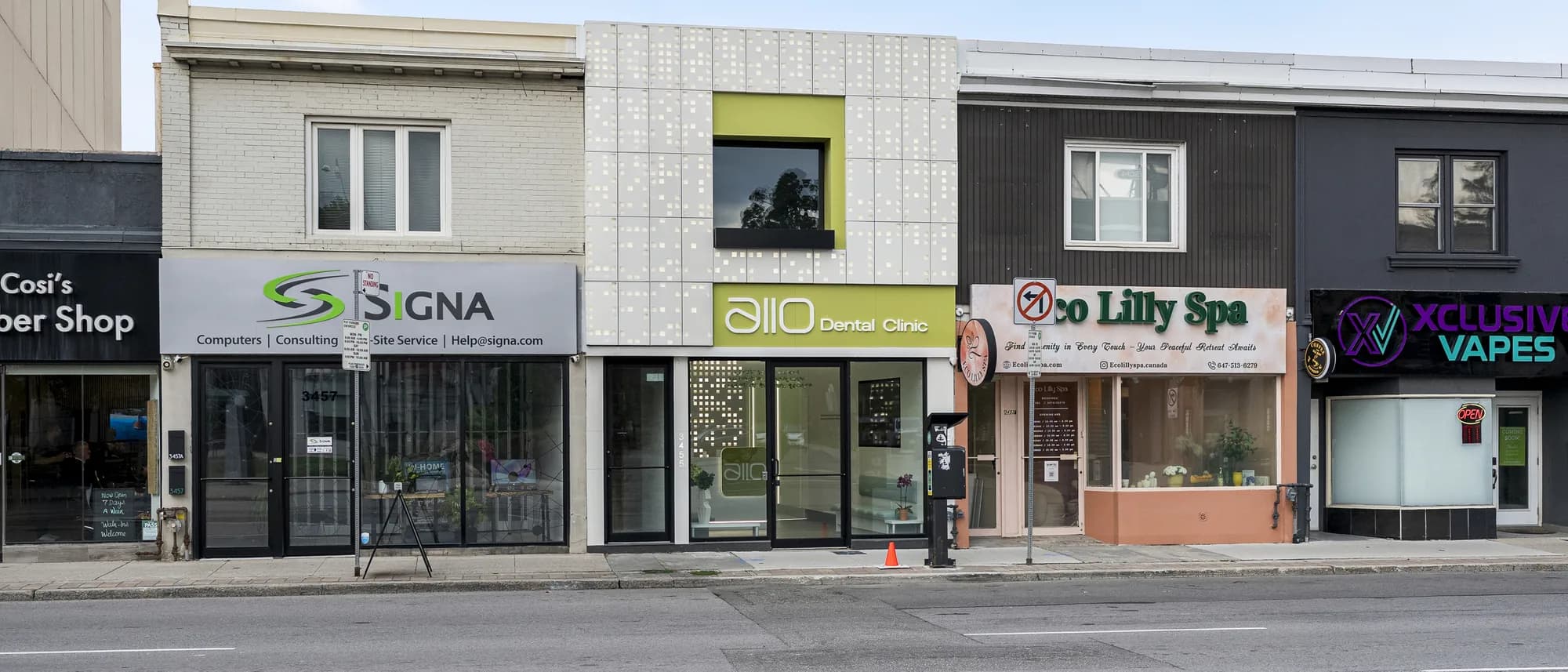 The Allo Dental Clinic storefront on Yonge Street, with the olive allo sign over a glass front, between the neighbouring shops